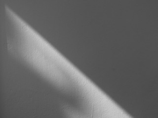 shadow on white wall with light from the window