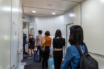 Bangkok, Thailand on August 6, 2020:  Social distancing on the bridge connecting the plane.