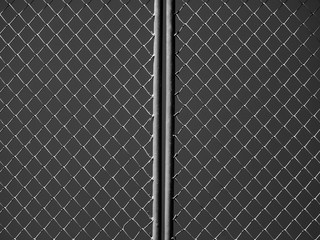 wire mesh of door at prison black and white style