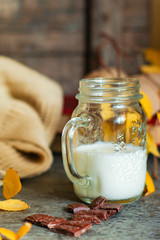 cup with milk and cookies on the table, autumn leaves comfort serving size organic healthy ething natural product portion top view place for text copy space