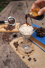 Coffee and ice cream on a brown wooden table