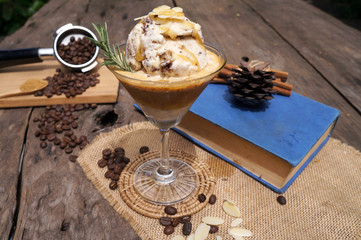 Coffee and ice cream on a brown wooden table