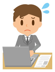 ビジネスマン　デスクワーク　パソコン　仕事　困る