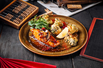 Cooked salmon fillet with fried cauliflower