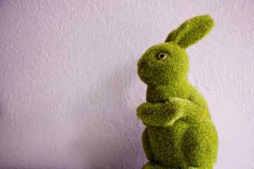 Easter Bunny figurine coated in green fake grass