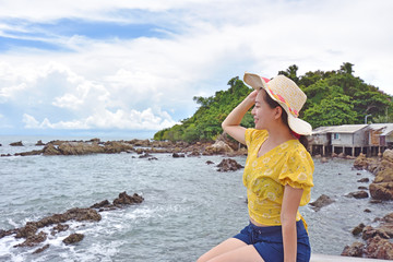 Traveler Asian woman on vacation at the coast of the sea Thailand