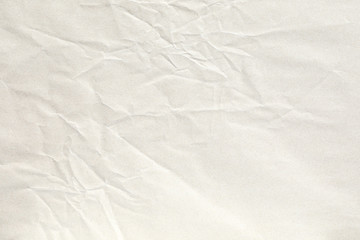 Crumpled pale brown paper texture