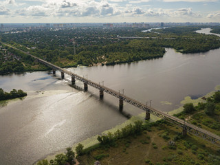 Fototapeta premium Aerial drone view. Railway bridge over the Dnieper river in Kiev.