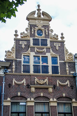 Deventer, Netherlands - July 11 2020: Ancient Facade of an old "Golden Age" style house in the center of town.