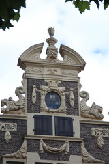 Deventer, Netherlands - July 11 2020: Ancient Facade of an old "Golden Age" style house in the center of town.