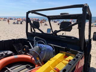 Lifeguards car with rescue equipment on the beach