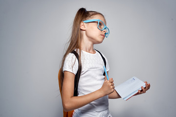 Schoolgirl with backpack glasses white tank top training education