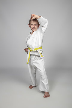 child martial arts in age uke pose.
