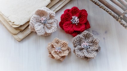 Fototapeta na wymiar Artificial handmade flowers made out of beautiful yarn texture