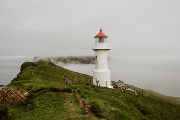 Fototapeta na wymiar Mykines Lighthouse in the Faroe Islands - The Puffin Island