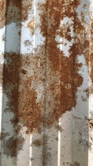 Rust on the iron fence plate background on the wall.