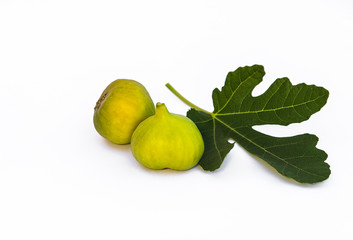 Isolated two figs with leaf on white background.