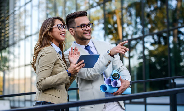 Conversation about projects. Business people in front of the corporation. Business, lifestyle concept