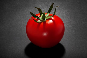 tomato isolated on black background