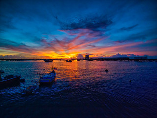 Coastal fishing boats are waiting water tide on sunset at the Bang sean's bay , Thailand.