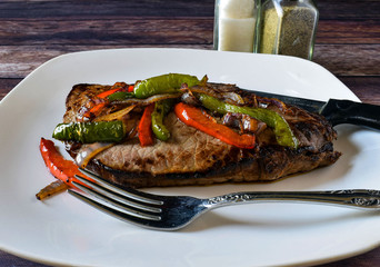 steak with onions and peppers