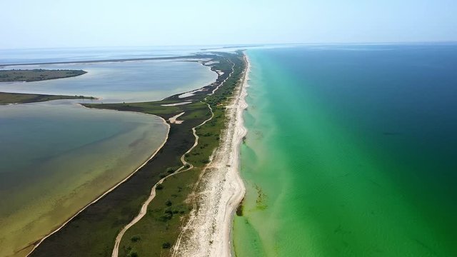 Flight over the Kinburn spit, sea white sand, Copter video
