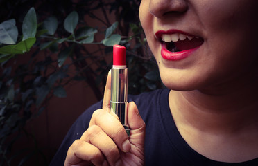 woman applying lipstick