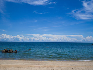 The sandy sea beach with beautiful landscape of sea under the clear sky and sun in Koh Tao, Thailand