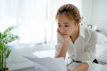 Asian women tired after hard work. She still works hard in the bedroom.