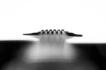 Strings of an acoustic guitar