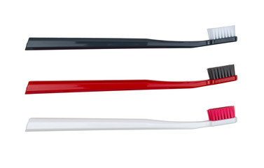 New toothbrushes - white, red and black - isolated on a white background - side view