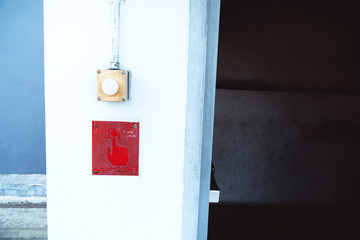 The old alarm button outside and beside the fire exit door before going inside the building, the fire alarm button is very old, should be improved and ready to use at all times.