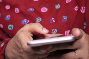 close up of women hand holding smart phone 