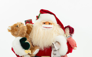 Macro Santa Claus decoration wearing a mask that says you'd better watch out isolated on white