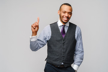 African-American businessmanman showing ONE by finger over grey background