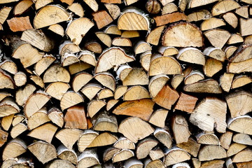 Natural wooden background,closeup of chopped firewood, Stack of dry chopped wooden logs