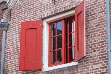 Close up view of historical, traditional Dutch windows and shutters showing.