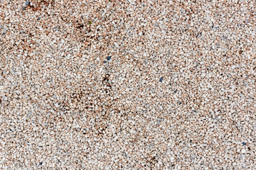 Abstract texture with fine beige gravel