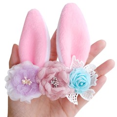 Handmade flowers as headband hair accessory with bunny or rabbit ears as decoraiton in soft pastel colors