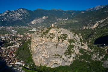 Obraz premium View at Arco castle, popular tourist destination. Flying on drone, aerial view of Arco Castle ruins, Lake Garda. Italy.