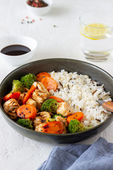 Chicken with rice, broccoli, carrots and soy sauce. Healthy eating. Diet. Recipe.