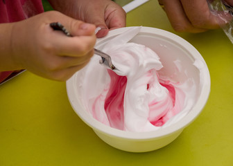bowl with a colorful slime, making a slime at a birthday party, children's games - making a slime