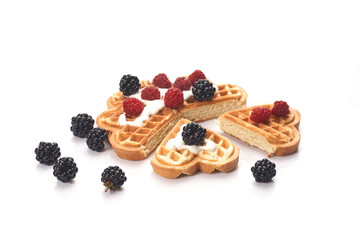 Belgium waffles with fresh berries isolated on white background