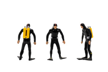 Miniature people : Scuba diver isolated on white background with clipping path