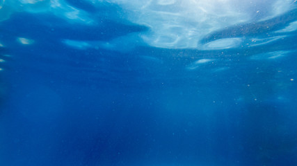 View from underwater with a calm surface
