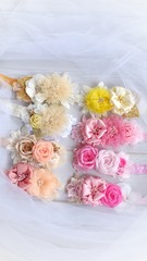 Handmade headband flower made out of flower fabric in beautiful pastel colors. The handmade floral is great for hair accessories with its colorful flower and beautiful for hair band.