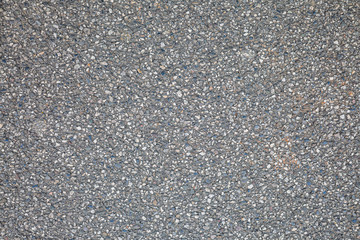 Stony surface of asphalt. Tarmac grey grainy road. Texture Background. Top view
