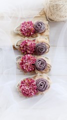 Handmade flower as headband hair accessory made out of fabric flowers in beautiful pastel colors