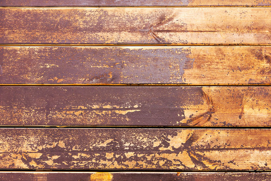 Footprints of shoes on painted wooden boards. Selective focus.