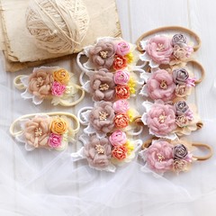 Handmade flower headband hair accessory made out of fabric flowers in beautiful pastel colors